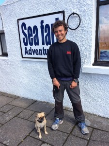 Tiago with a pug.