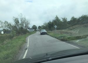 Passing places are used to allow cars to pass each other safely on single track roads - here the approaching car has pulled over to allow us to pass.