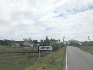 Pass through the village of Balvicar.